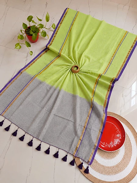 Pure 120 count soft Kadhi Mulmul cotton a light green body paired with a gray pallu